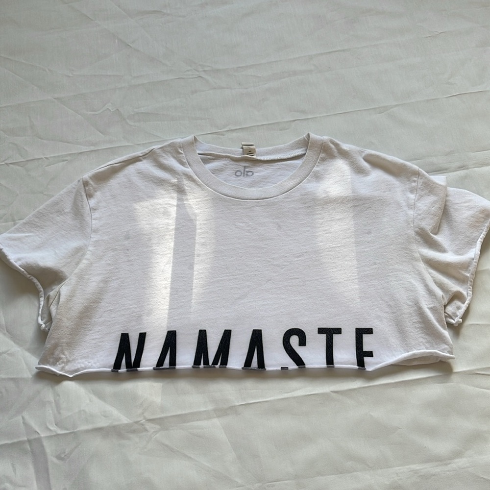 1488- Alo White Crop Top with 'Namaste' Print in black- xsmall